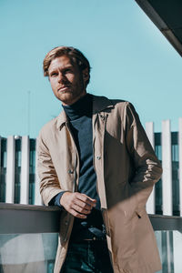 Portrait of young man standing outdoors