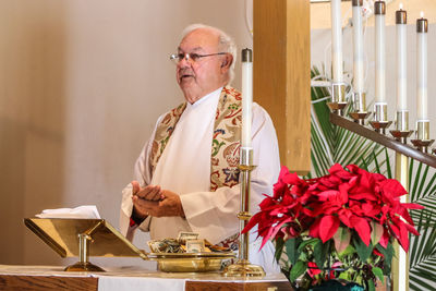 Priest giving speech in church