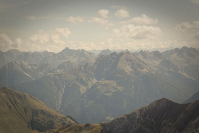 View of mountain range against cloudy sky