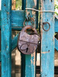 Close-up of padlock on wooden door