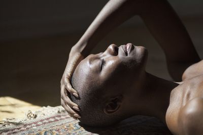 Close up of young woman relaxing indoors