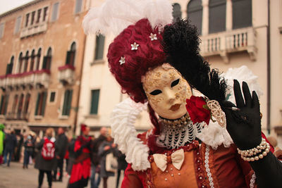 Venice carnival, italy.  rear view of woman wearing mask