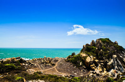 Scenic view of sea against blue sky