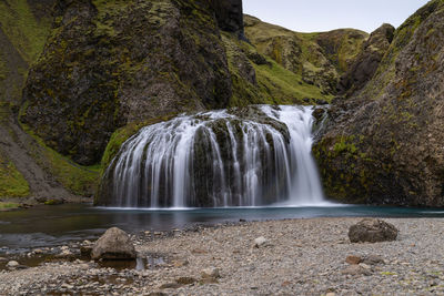 Scenic view of waterfall - stjórnarfoss