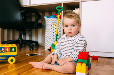 Cute little child is playing at home