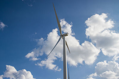 Low angle view of wind turbine against sky