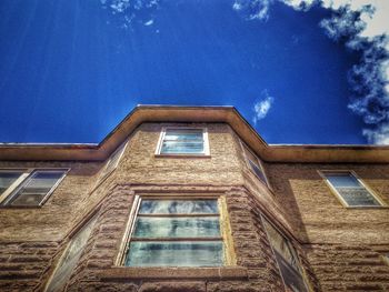 Low angle view of building against blue sky