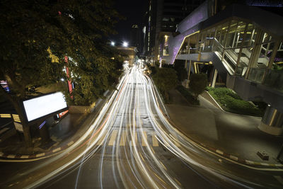 Vehicles on road in city at night