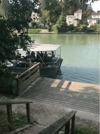 High angle view of empty bench by lake