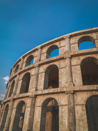 Low angle view of historical building against blue sky