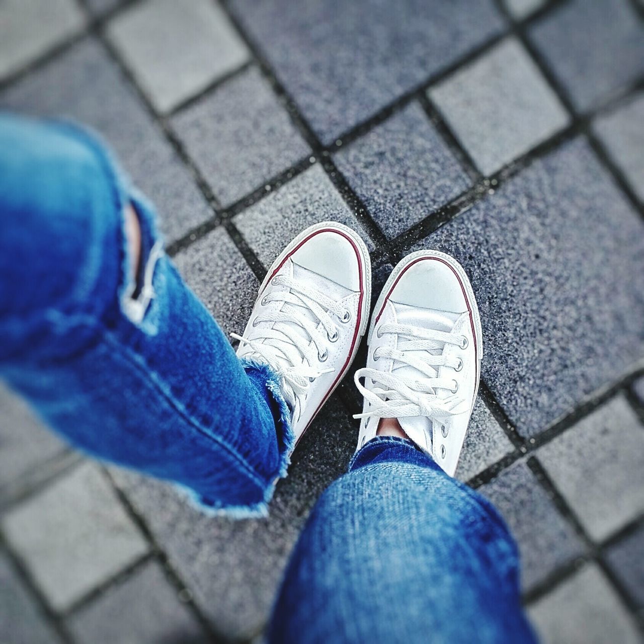 person, low section, shoe, personal perspective, footpath, selective focus, jeans, footwear, sitting, human foot, close-up, togetherness, standing, casual clothing, paving stone, blue, relaxation, friendship, floorboard, day