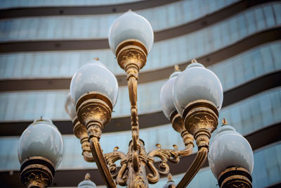 Low angle view of street light against building