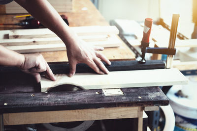 Cropped hands working on table