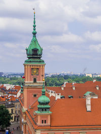 Buildings in town against sky