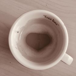 Directly above shot of coffee cup on table