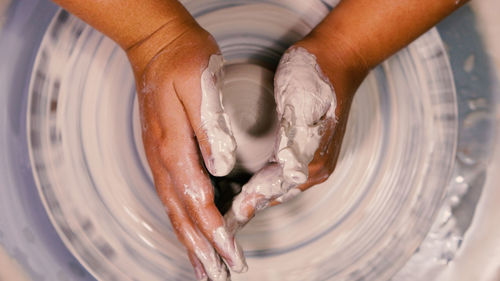 Cropped image of man washing hands