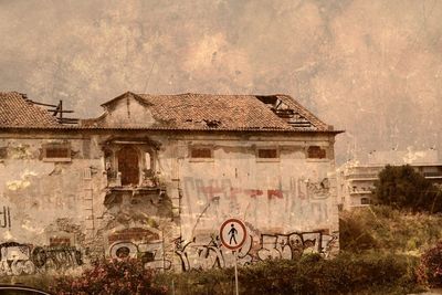 Old abandoned building against sky