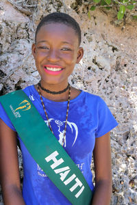 Portrait of smiling girl standing outdoors