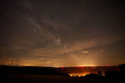 Scenic view of star field against sky at night