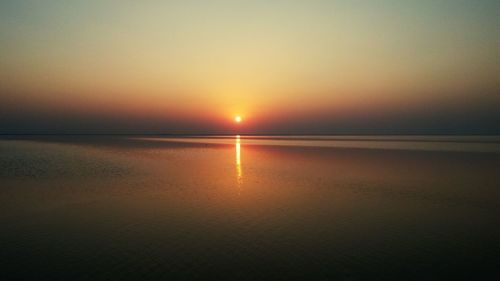 Scenic view of sea at sunset