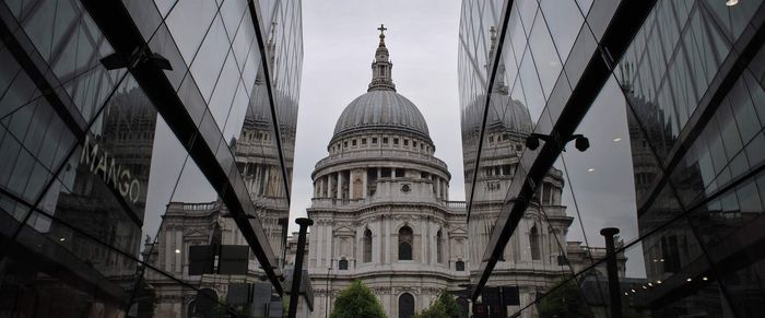 Low angle view of buildings against sky in city