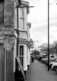 Street amidst buildings against sky