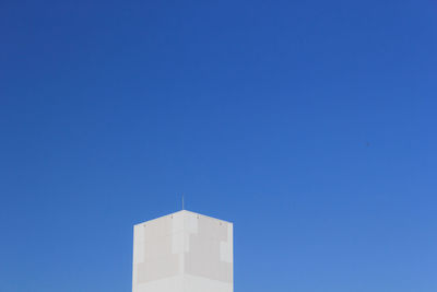Low angle view of building against blue sky
