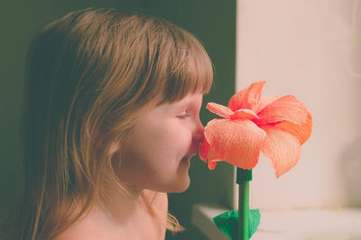 Close-up of girl holding flower