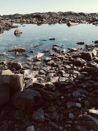 Scenic view of sea seen through rocks