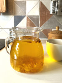 Close-up of glass jar on table