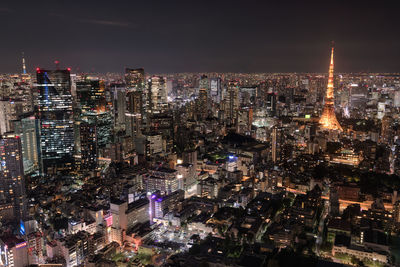 High angle view of illuminated city buildings at night