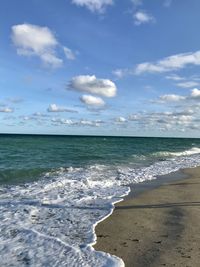Scenic view of beach against sky