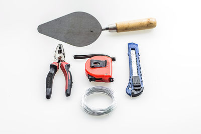 High angle view of work tools on white background