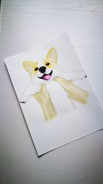 High angle view of stuffed toy on book