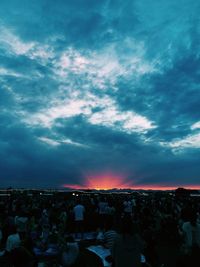 Clouds over city at sunset