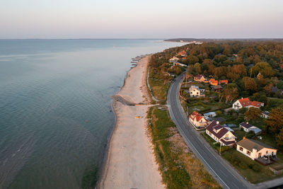 High angle view of road by sea against sky