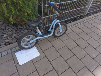 High angle view of bicycle on sidewalk