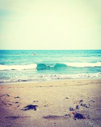 Scenic view of beach against clear sky