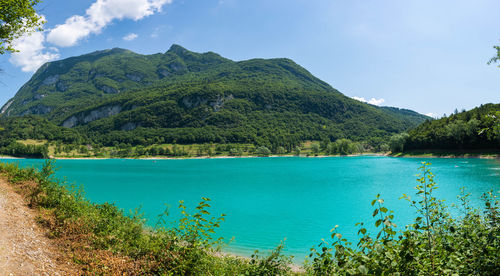 Scenic view of lake tenno italy against sky 