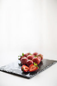 Close-up of strawberries in plate on table