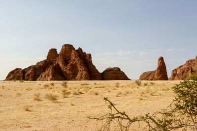 Rock formations in desert against sky