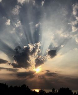 Low angle view of cloudy sky at sunset