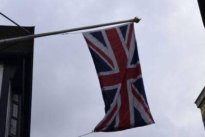 Low angle view of flag against sky