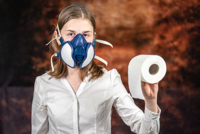 Portrait of a woman holding camera