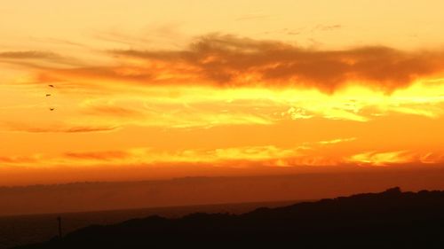 Scenic view of landscape against sky during sunset