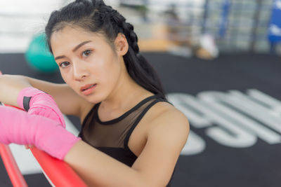 Young woman exercising at gym