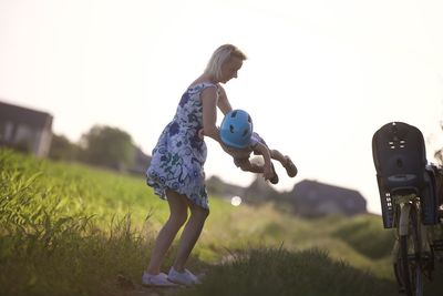 Full length of woman standing on field