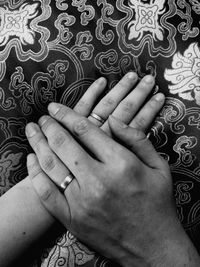 Low section of people on hands