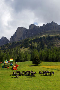 Scenic view of field against mountain