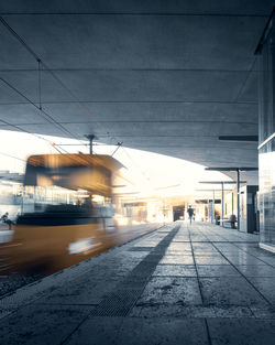 Blurred motion of train in city against sky